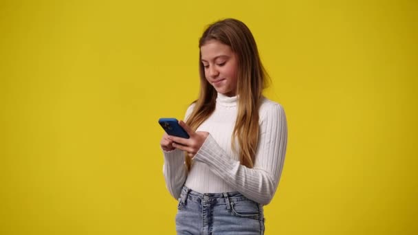 Video One Young Girl Who Using Phone Yellow Background Concept — Stock Video