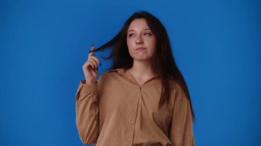 4k video of cute woman over blue background. Concept of emotions.