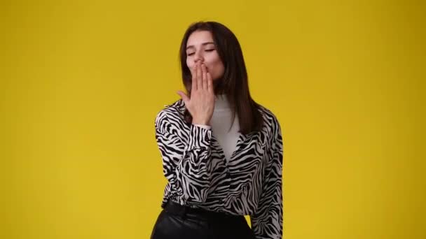 Video One Girl Who Sends Kiss Air Yellow Background Concept — Stock Video