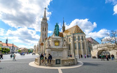 St. Stephen Statue and Matthias Church in Budapest, Hungary. A church located in front of the Fisherman's Bastion at the heart of Buda's Castle District.