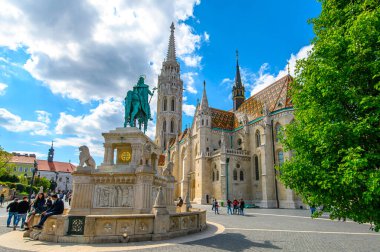 St. Stephen Statue and Matthias Church in Budapest, Hungary. A church located in front of the Fisherman's Bastion at the heart of Buda's Castle District.
