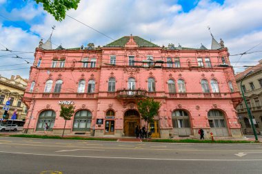 Szeged, Hungary. Front view the facade of beautiful old building with old sculptures in the city center