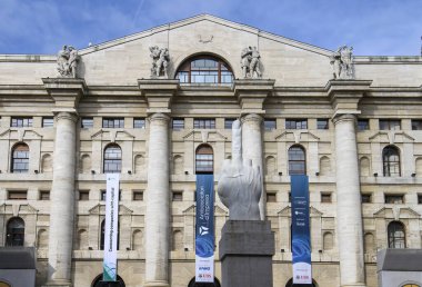 Milan, Italy. Palazzo Mezzanotte, seat of the Italian stock exchange and L.O.V.E. marble sculpture clipart