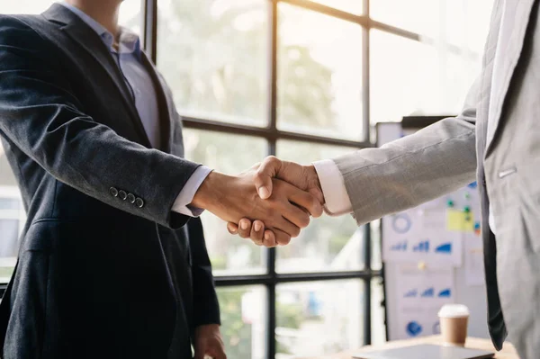 stock image Two confident businessmen shaking hands during a meeting in the office, success, dealing, greeting and partner 