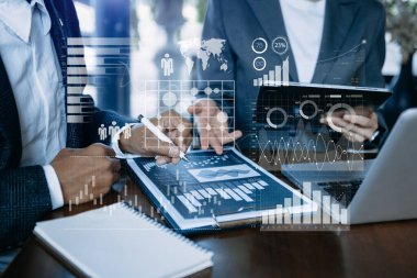 Financial report data of business operations balance sheet and income statement and diagram as Fintech concept.Business team meeting. digital tablet and laptop