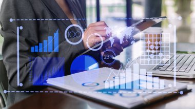 Intelligence and business analytics with dashboard concept.Website designer working in come digital tablet computer laptop.