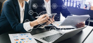 API Application Programming Interface, woman using laptop, tablet and smartphone with virtual screen API icon Software development tool, modern technology and networking concept