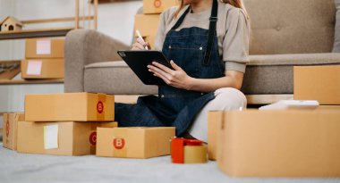 Small business entrepreneur SME freelance woman working at home office, BOX,tablet and laptop online, marketing, packaging, delivery, concept