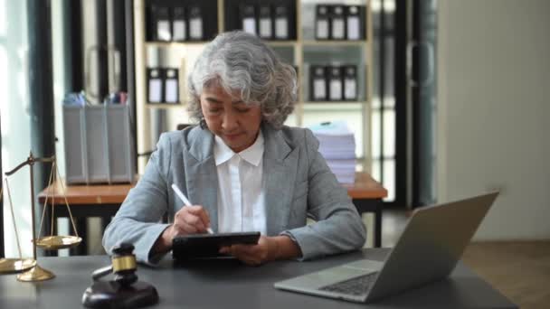 Asian Senior Woman Lawyer Working Gavel Tablet Laptop Front Advice — стокове відео