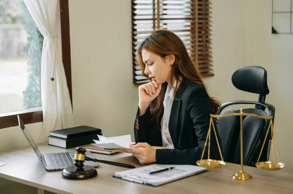 beautiful young asian lawyer woman sitting working in the modern office