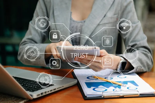 Zero trust security concept ,woman using computer laptop and tablet with zero trust icon on virtual screen of Data businesses.in office