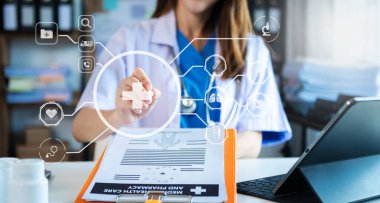 medical technology concept,smart female doctor  working with tablet pc with  virtual icons