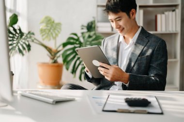 businessman executive manager and online webinar training or having virtual meeting video conference doing market research working in modern office.