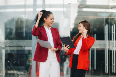 Asian business team , teamwork celebrating achievement and in planning design at business center.