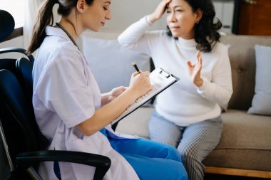 Psychology, depression. Suffering asian old woman, consulting with  doctor while patient counseling mental problem. Encouraging, therapy, health care