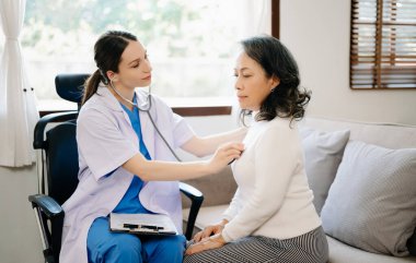 The doctor using a stethoscope checking patient with examining, Healthcare and medical concept