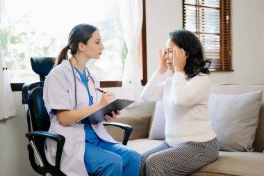 Psychology, depression. Suffering asian old woman, consulting with  doctor while patient counseling mental problem. Encouraging, therapy, health care
