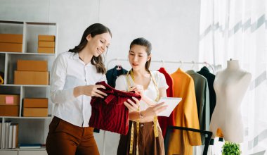  fashion designers working with clothes  at the studio