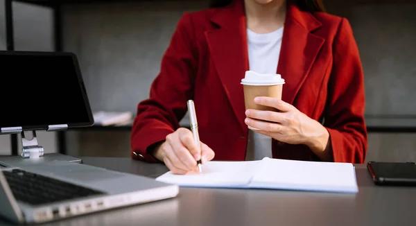 stock image Businesswoman  using smart phone, laptop and tablet with coffee 