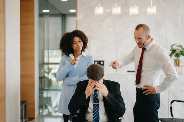 Team thinking of problem solution at modern office meeting, sad diverse business people group shocked by bad news, upset colleagues in panic after company bankruptcy concept