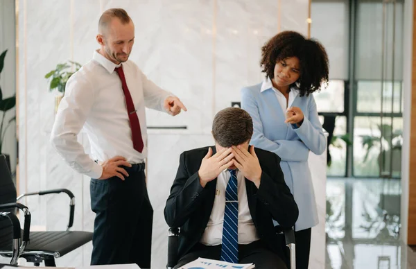 Team thinking of problem solution at modern office meeting, sad diverse business people group shocked by bad news, upset colleagues in panic after company bankruptcy concept
