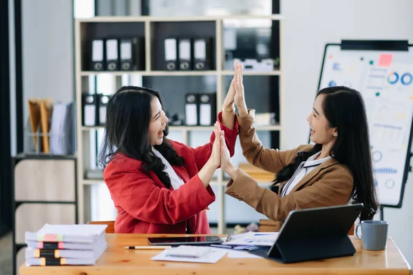 Stock image Young Asian business team creative businesspeople coworker, teamwork celebrating achievement and in planning design in creative in office