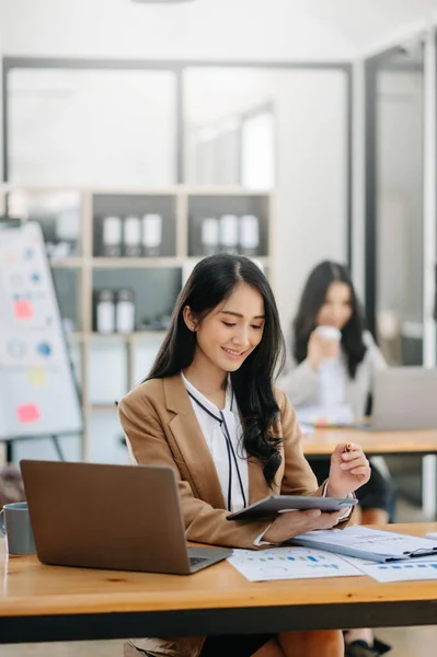 stock image Young attractive Asian female office workers  at camera in office