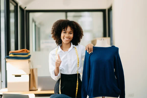 Stock image Calm curly brunette  woman  in office of fashion designer 