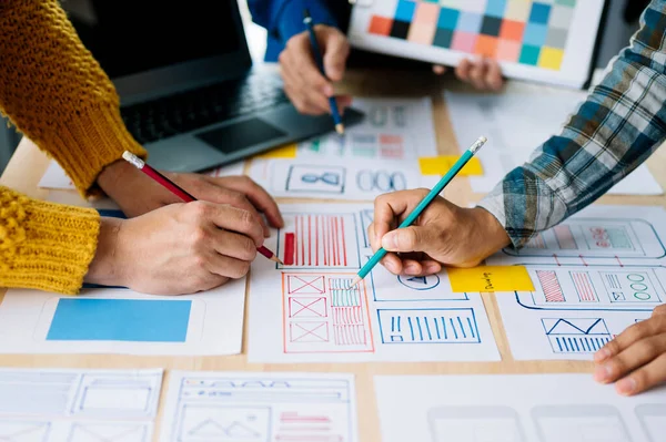 stock image Close up view of UI developer team brainstorming on their project with laptop. Creative digital development agency. in office