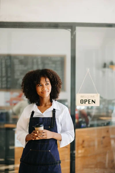 Startup successful small business owner  woman stand   in cafe