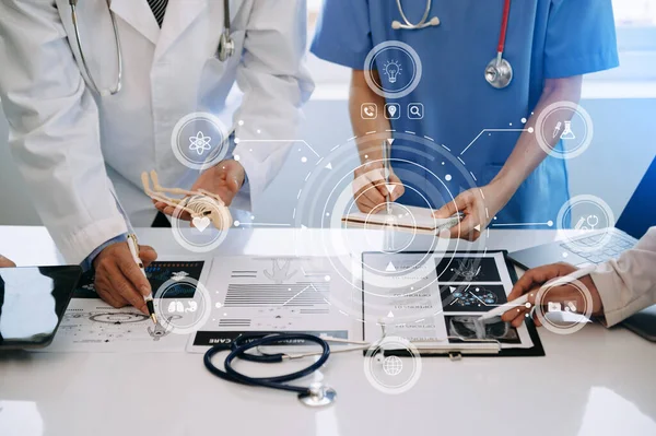 Medical technology network team meeting concept. Doctors  working with  modern digital tablet and laptop computer with graphics chart interface