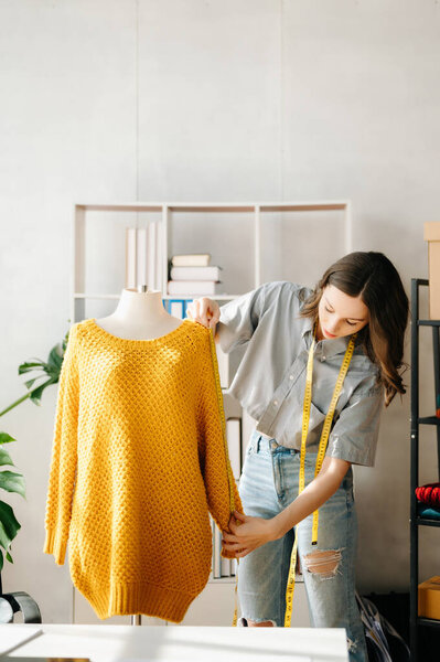 Caucasian young woman ,fashion designer  in office 