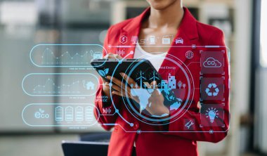 Businesswoman working virtual tablet computer with reduce CO2 concept with icons, global warming such as reforest green factory recycle in office