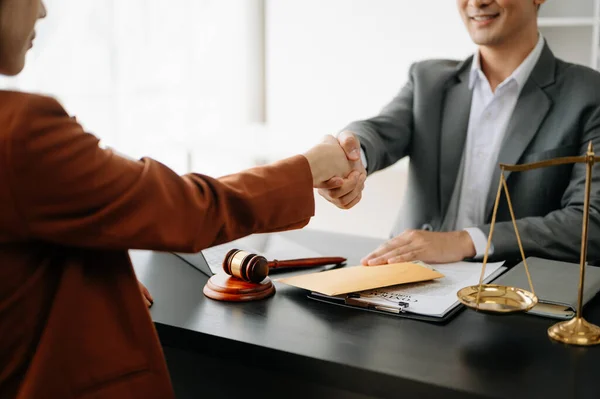 Man lawyer handshake with client at the modern office