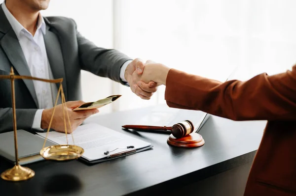 Man lawyer handshake with client at the modern office
