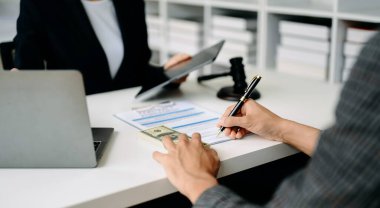 business people discussing contract papers sitting at the table. Concepts of law, advice, legal services