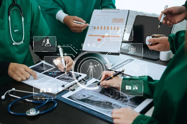 Medical technology network team meeting concept. Doctor hand working with smart phone modern digital tablet and laptop computer with graphics chart interface, with virtual icon