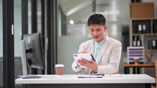 Successful Asian Businessman Analyzing Finance Digital Tablet Modern Office Desk — Stock Video