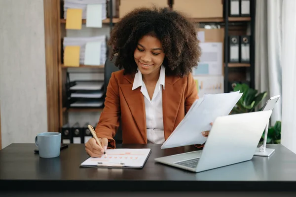 stock image Young beautiful African businesswoman working in modern office