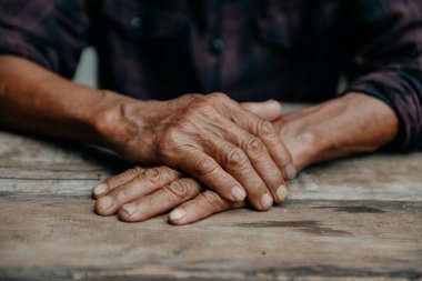 Close up of male wrinkled hands