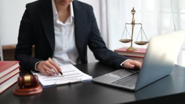 justice and law concept.Male judge in a courtroom on wooden table and Counselor or Male lawyer working in office.