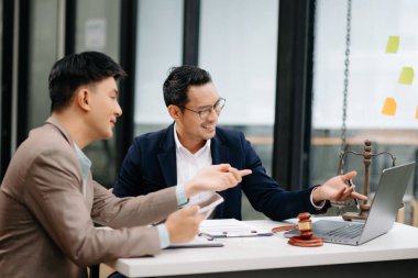 business people discussing contract papers sitting at the table. Concepts of law, advice, legal services