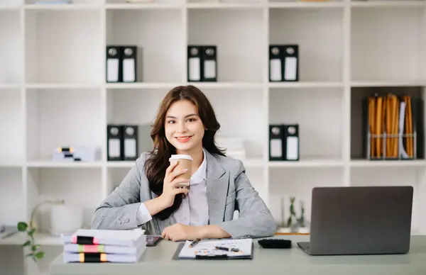 Confident business expert attractive smiling on desk in creative office