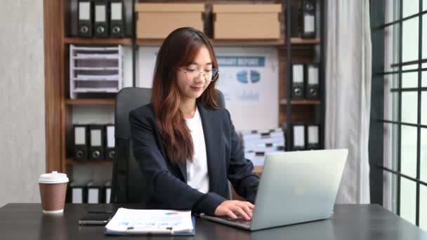 Asian Businesswoman Analyzing Finance Laptop Modern Office Desk Tax Report — Stock Video