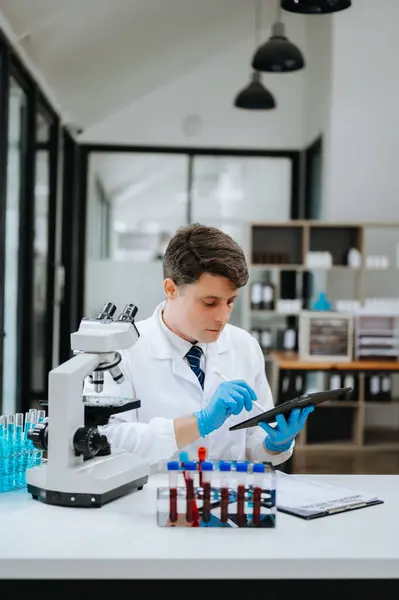 Modern medical research laboratory. scientist working with micro pipettes, analyzing biochemical samples, advanced science chemical laboratory for medicine.