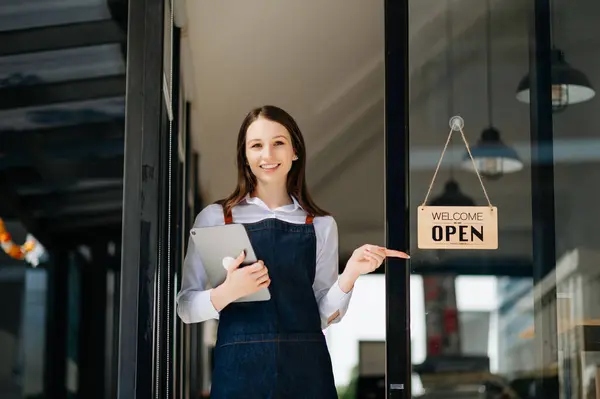 stock image Startup successful small business owner stand with tablet  in cafe