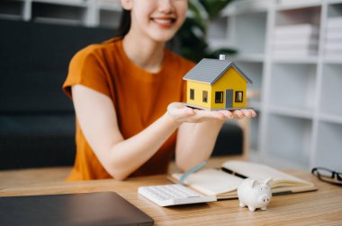 Considering buying a home, investing in real estate. Broker signs a sales agreement. agent, lease agreement, successful deal