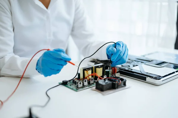 Electronics technician, electronic engineering electronic repair,electronics measuring and testing, repair and uses a voltage meter to check electricity