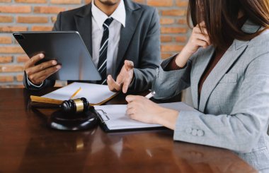 lawyers discussing contract papers sitting at the table. Concepts of law, advice, legal services. in morning light