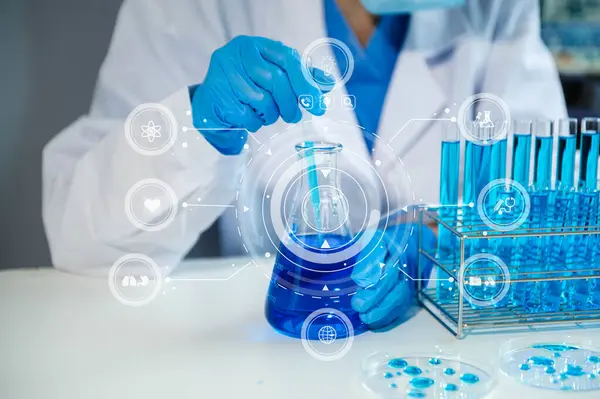 Scientist mixing chemical liquids in the chemistry lab. Researcher working in the chemical laboratory and new chemical substances with virtual icon